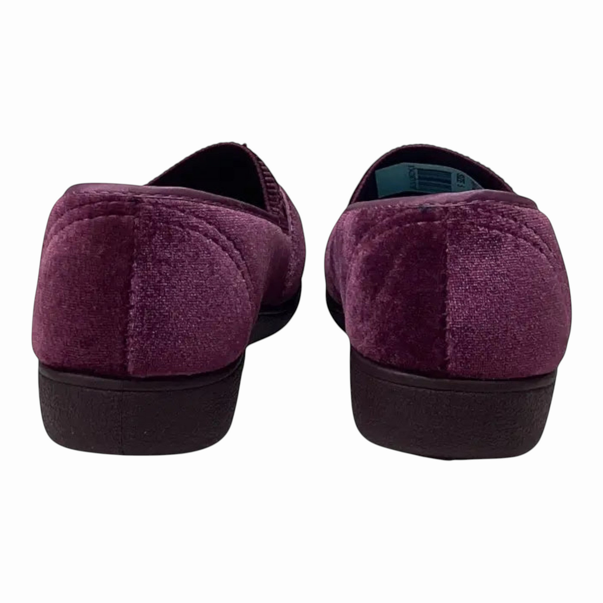 The Shoe Shop Sasha plush velvet slippers in deep purple with a low-profile black sole, shown from the back.