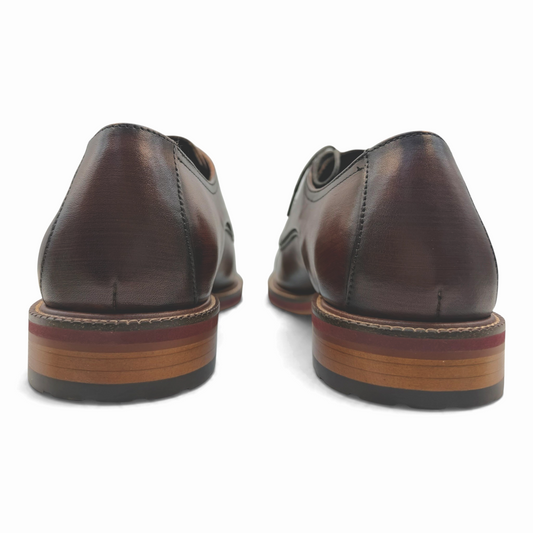 The Shoe Shop Scribble brown leather lace-up dress shoes viewed from the back showing the stacked sole detail