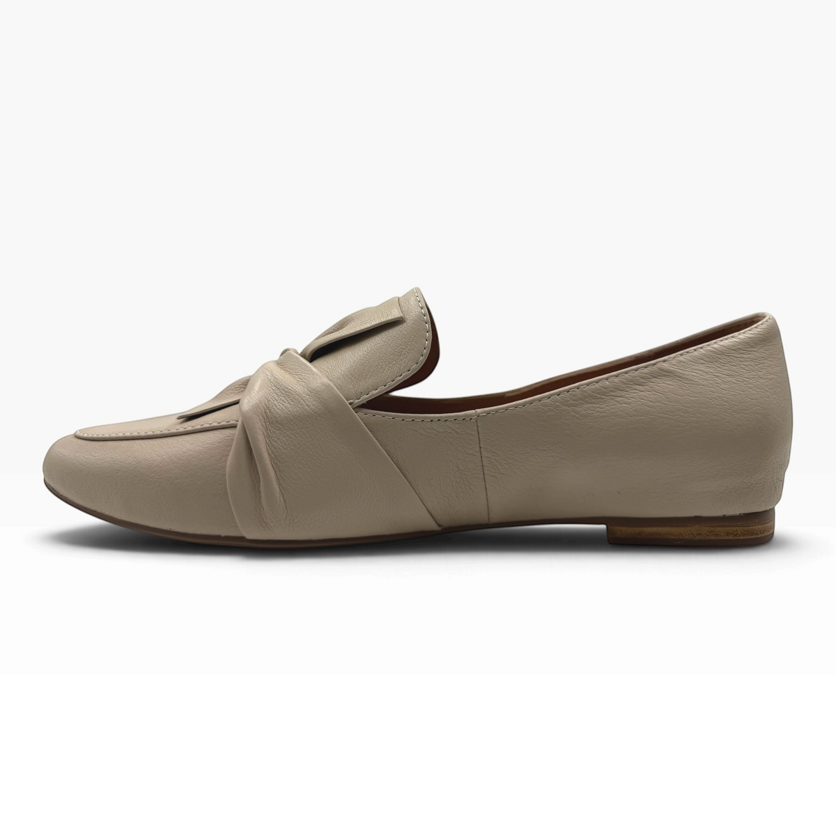 The Shoe Shop Sedone beige leather flat loafer with a knotted front detail and low heel, side view.