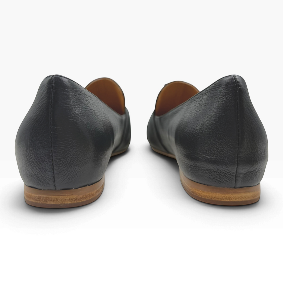 Back view of The Shoe Shop Sedone black leather flat shoes with a low wooden heel