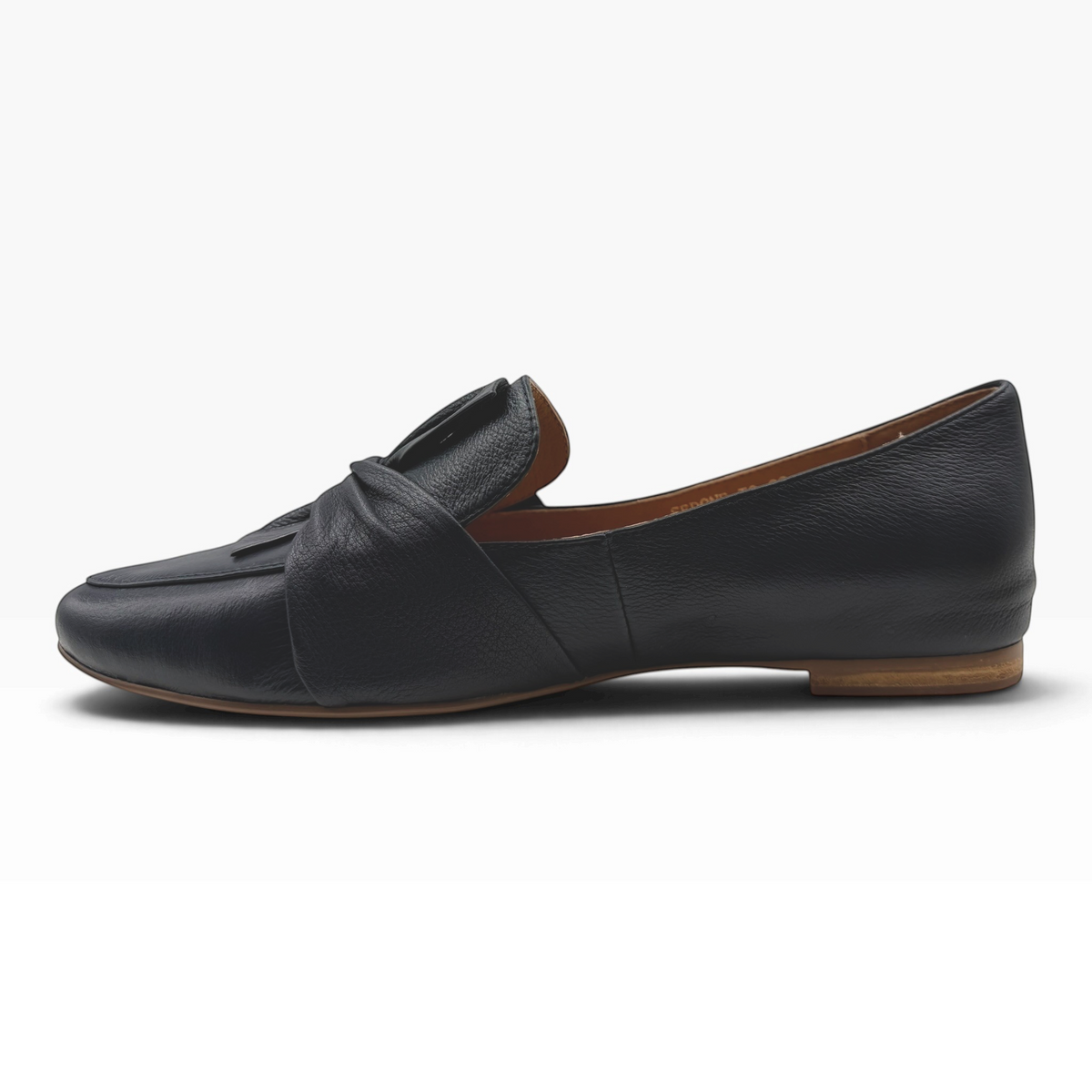 The Shoe Shop Sedone black leather loafers with a knotted front detail and flat sole, side view.