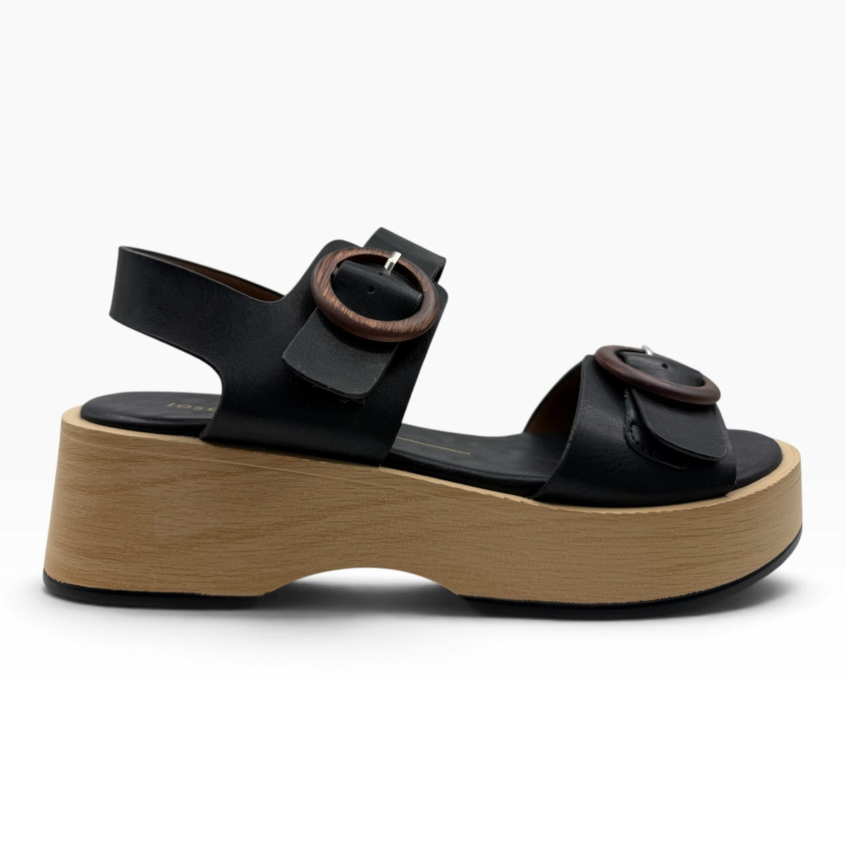 The Shoe Shop Selendra black leather platform sandals with wooden-look buckles and chunky light wood-effect soles.