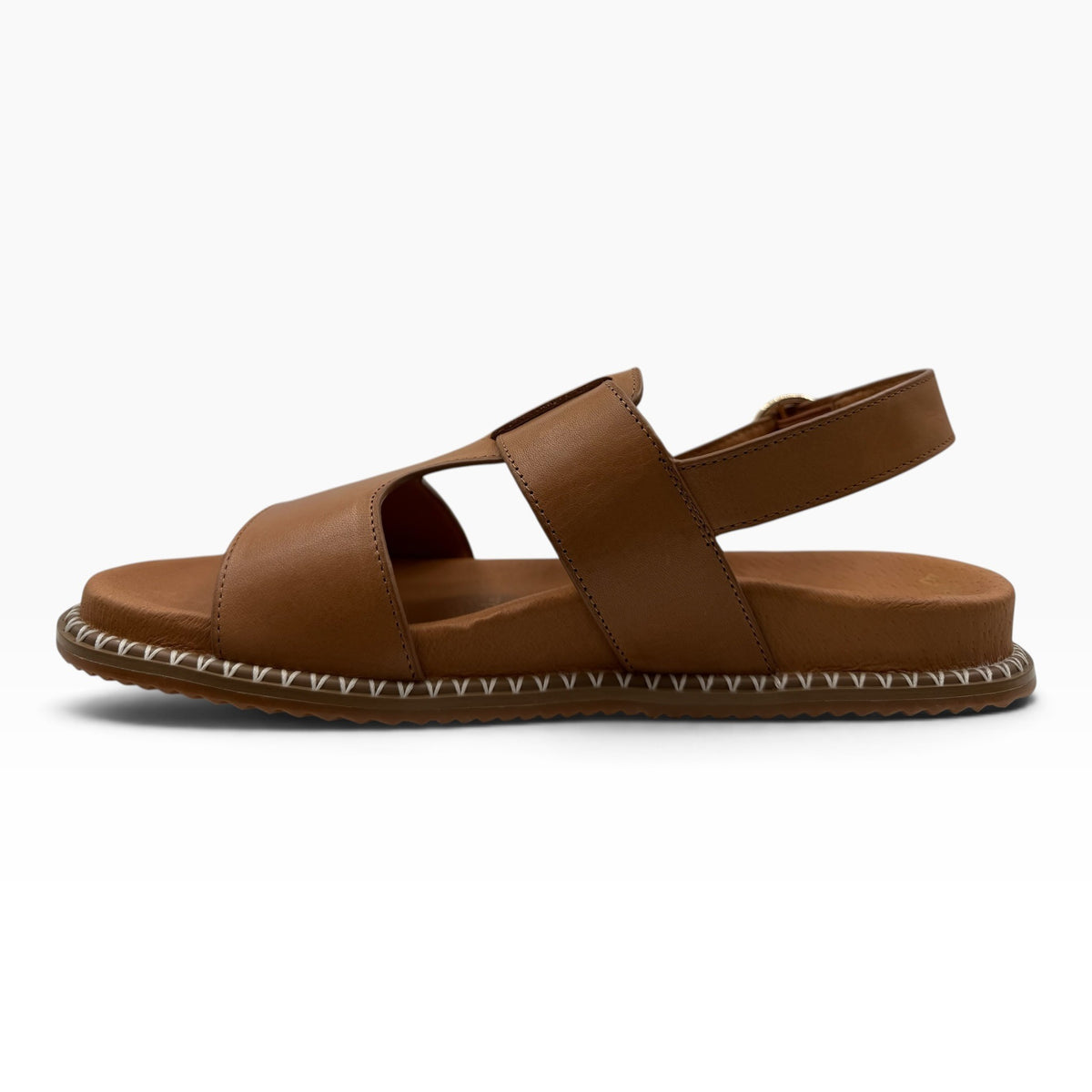 The Shoe Shop Serene tan leather flat sandal with a side buckle and decorative white stitched edge detail