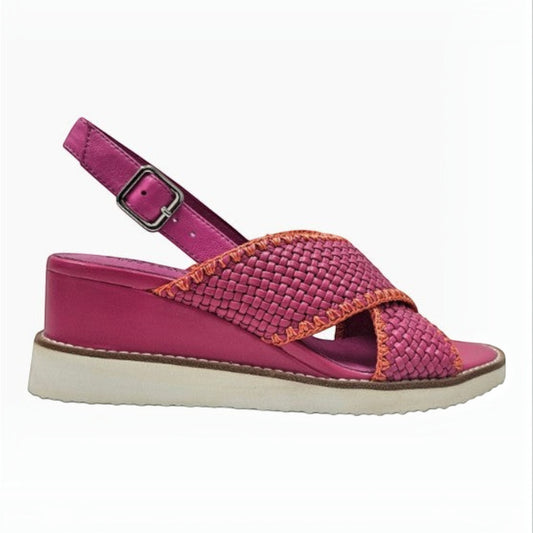 The Shoe Shop Shayna hot pink woven leather wedge sandal with an adjustable ankle strap and white platform sole.