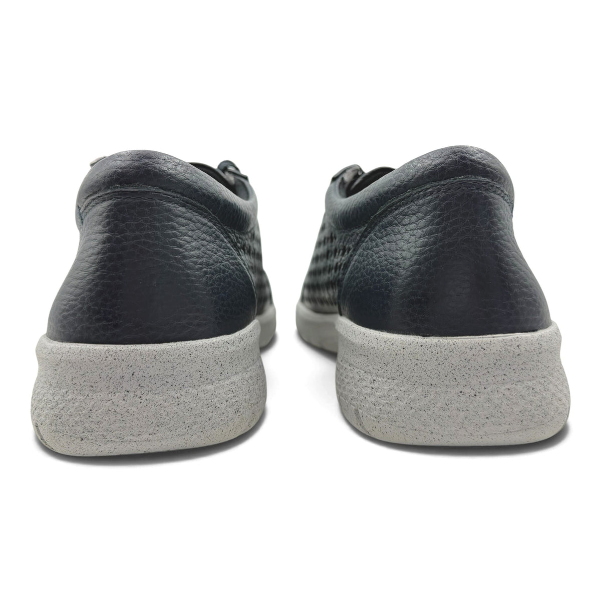 The Shoe Shop Shovo extra wide black leather sneakers showing the back view with a thick grey slip-resistant sole.