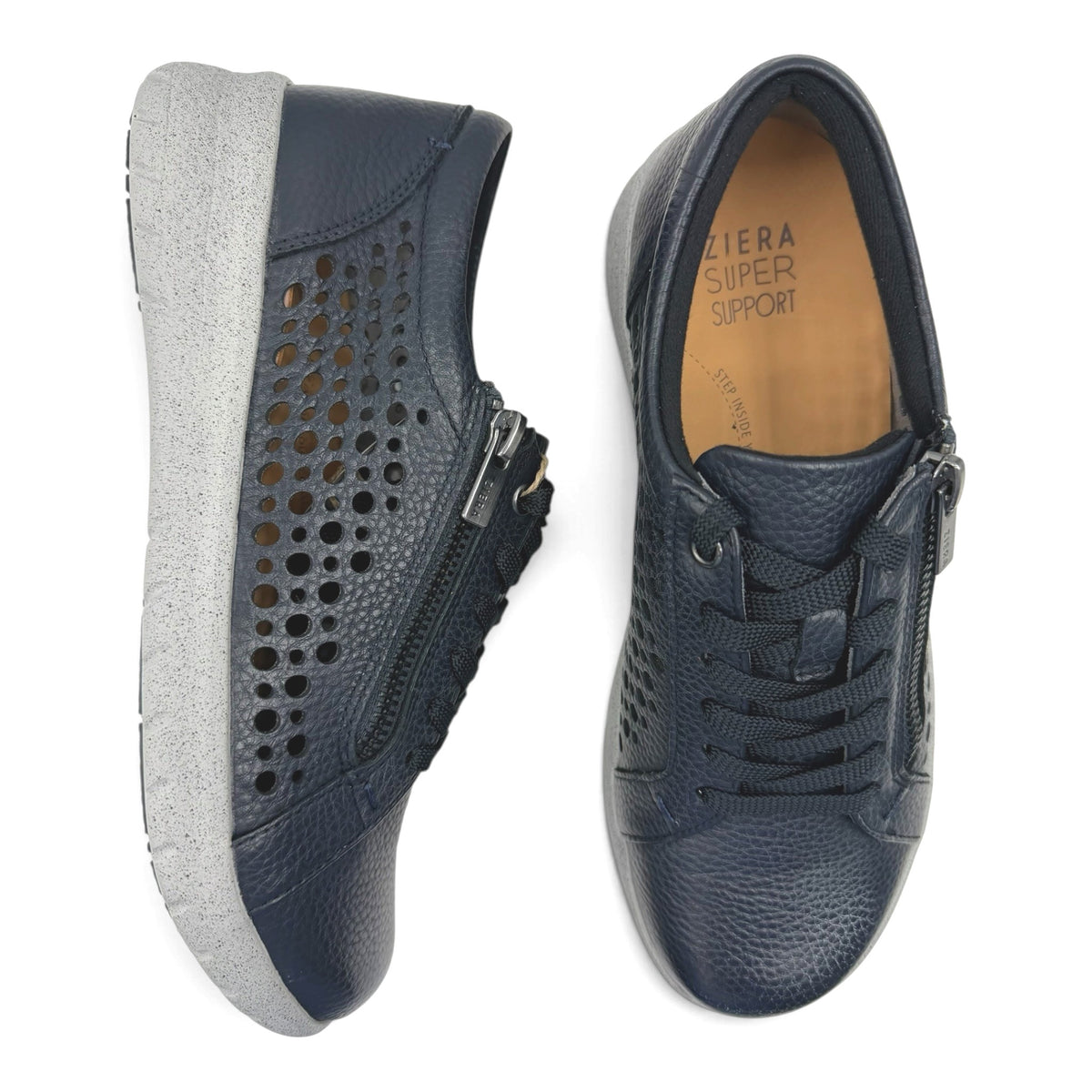 The Shoe Shop Shovo navy leather sneakers with perforated sides, lace-up front, side zip, and grey supportive sole.