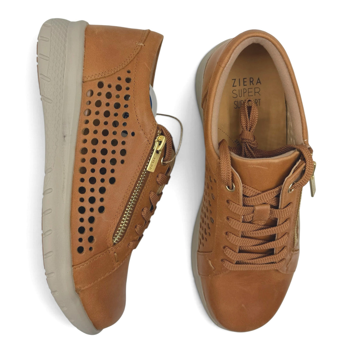 The Shoe Shop Shovo tan leather sneakers with perforated sides, lace-up front, and functional side zip.