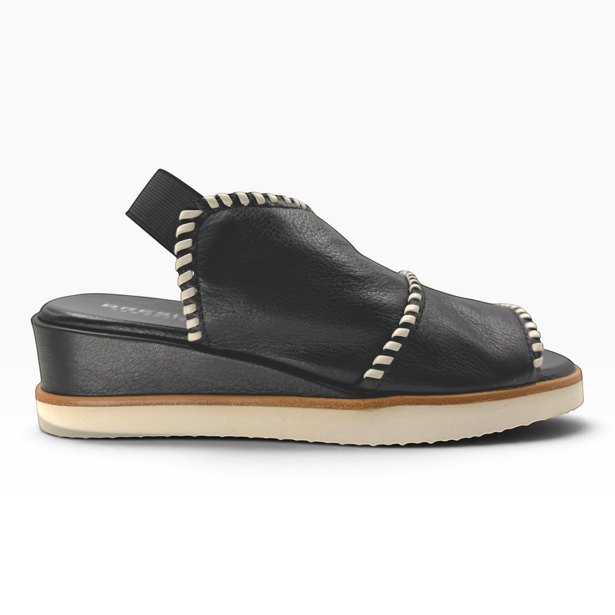 The Shoe Shop Sigma black leather wedge sandal with contrast white whipstitching and an elasticated slingback strap.