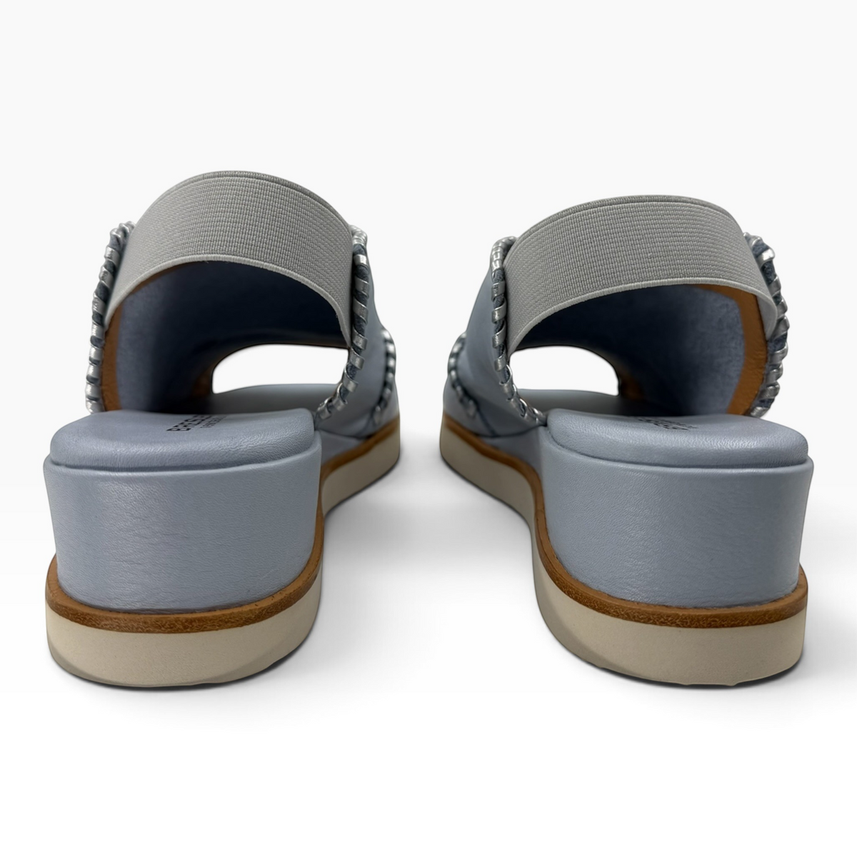The Shoe Shop Sigma light blue leather wedge sandals with elasticated slingback straps and contrast whipstitching.