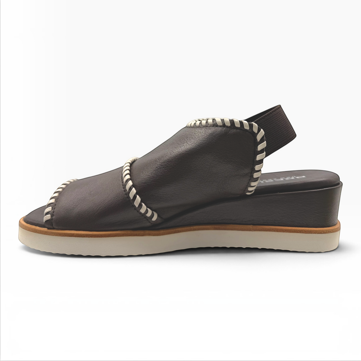 The Shoe Shop Sigma dark brown leather wedge sandal with contrast white whipstitch detailing and elastic slingback.