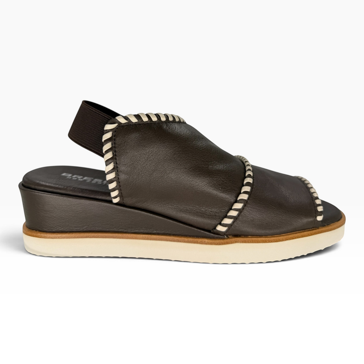 The Shoe Shop Sigma dark brown leather wedge sandal with contrast white whipstitch detailing and elastic slingback.