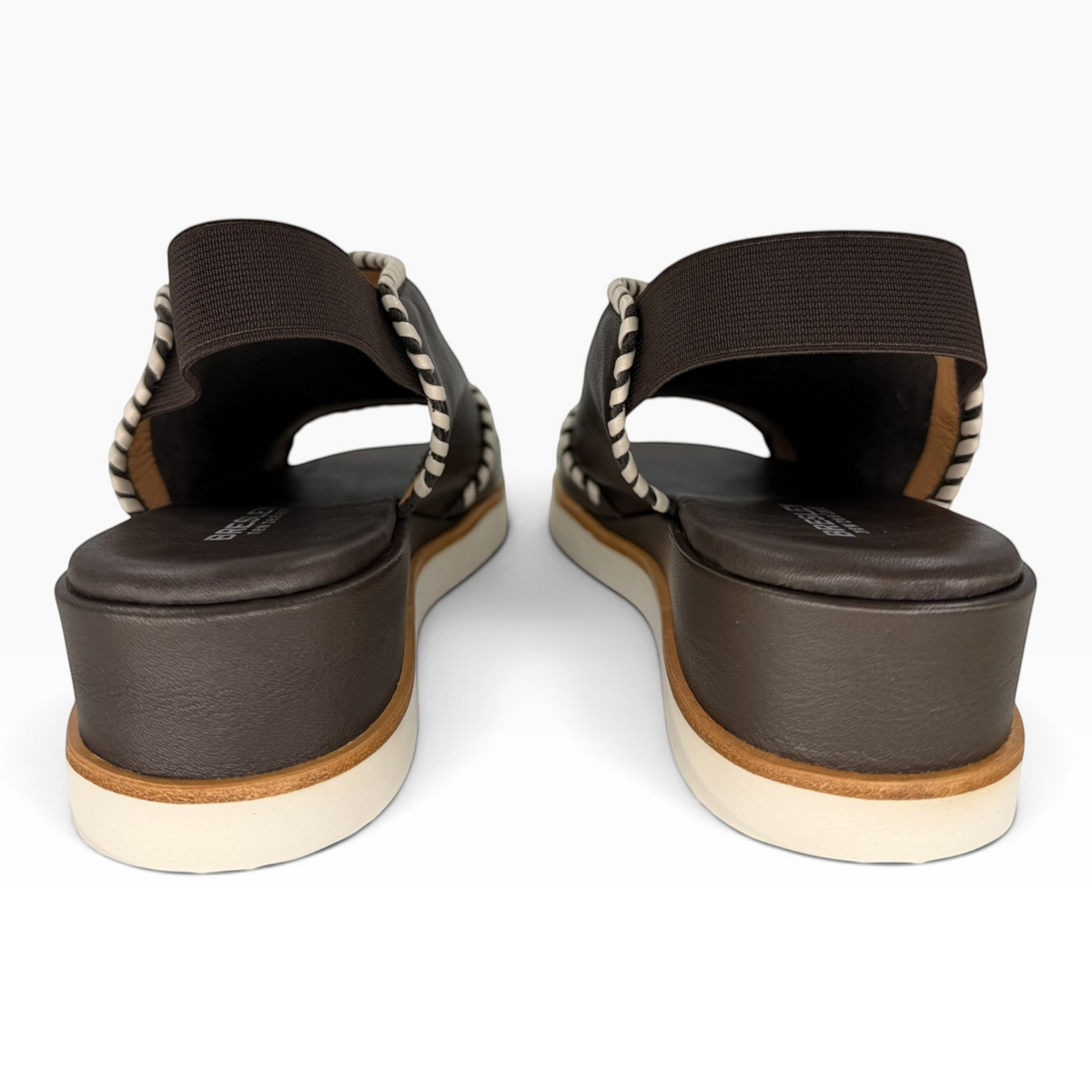 The Shoe Shop Sigma dark brown leather wedge sandals with contrast whipstitching and elasticated slingback straps.
