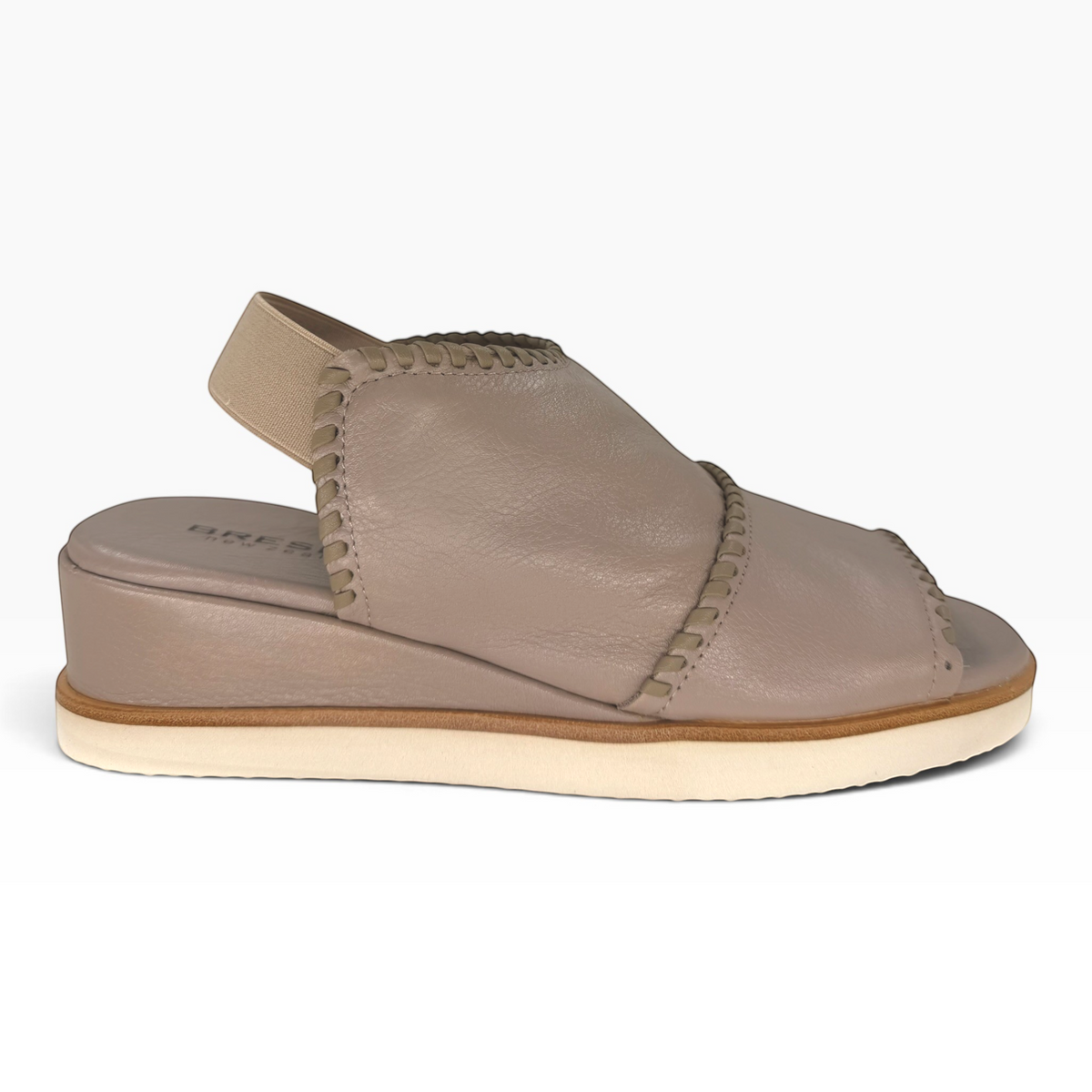 The Shoe Shop Sigma taupe leather wedge sandal with contrast whipstitch detail and elasticated slingback strap.
