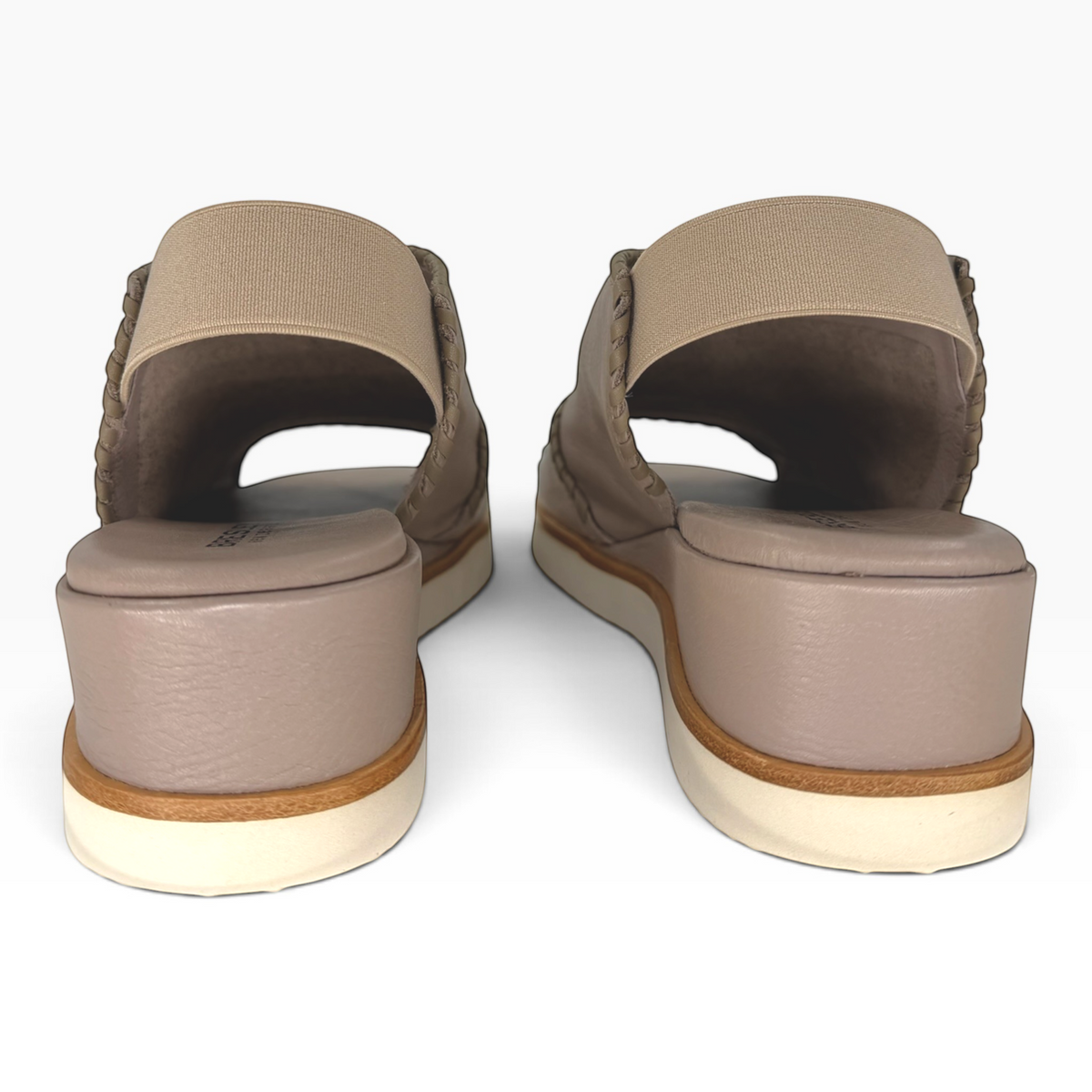 Rear view of The Shoe Shop Sigma leather wedge sandals in taupe with elasticated slingback straps and whipstitch detail