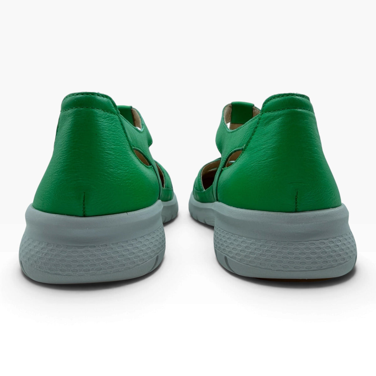 The Shoe Shop Sinsta green leather sandals with supportive grey soles, rear view showing wide heel stability.