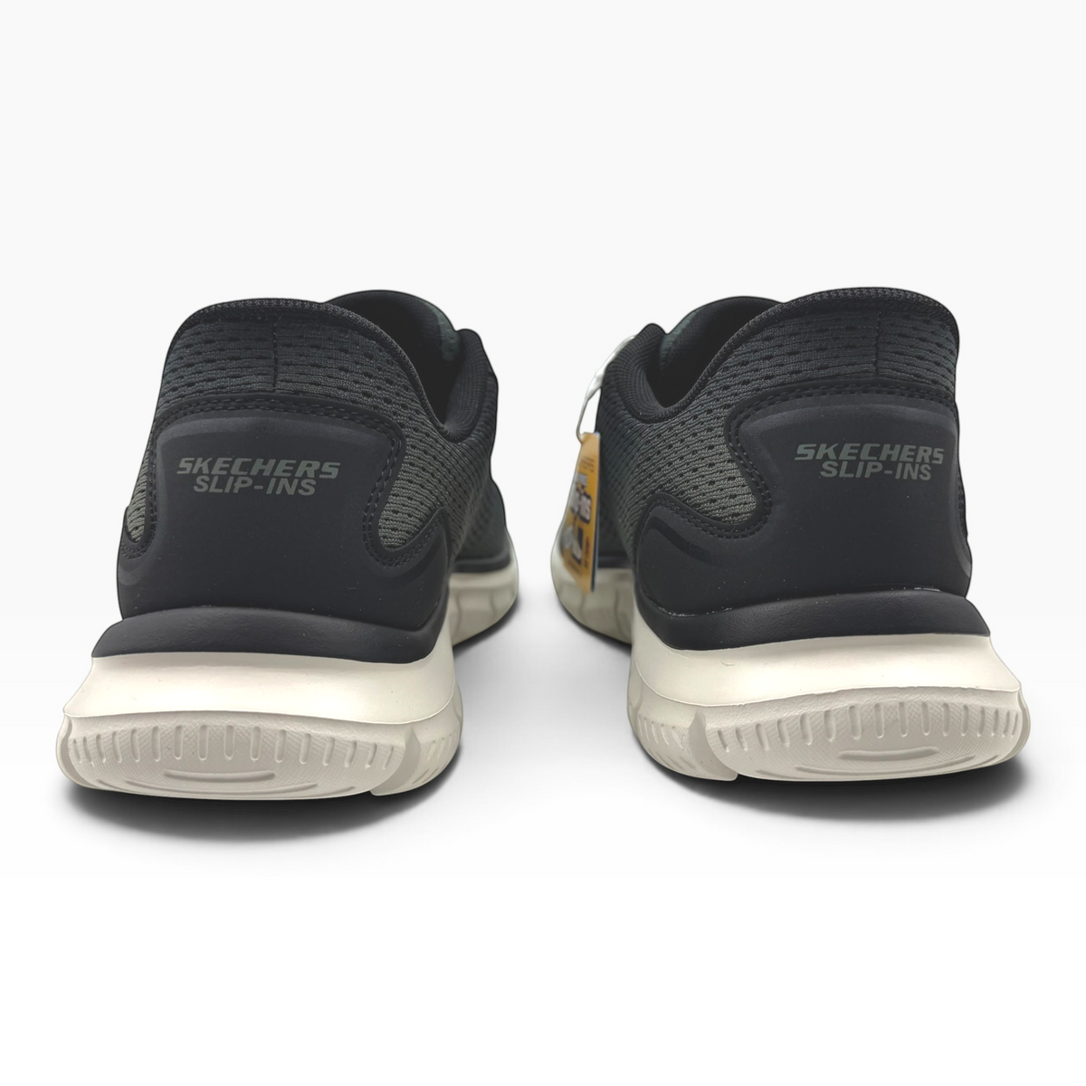 The Shoe Shop Skechers Slip-ins Track-Revno black mesh sneakers with beige cushioned soles, rear view