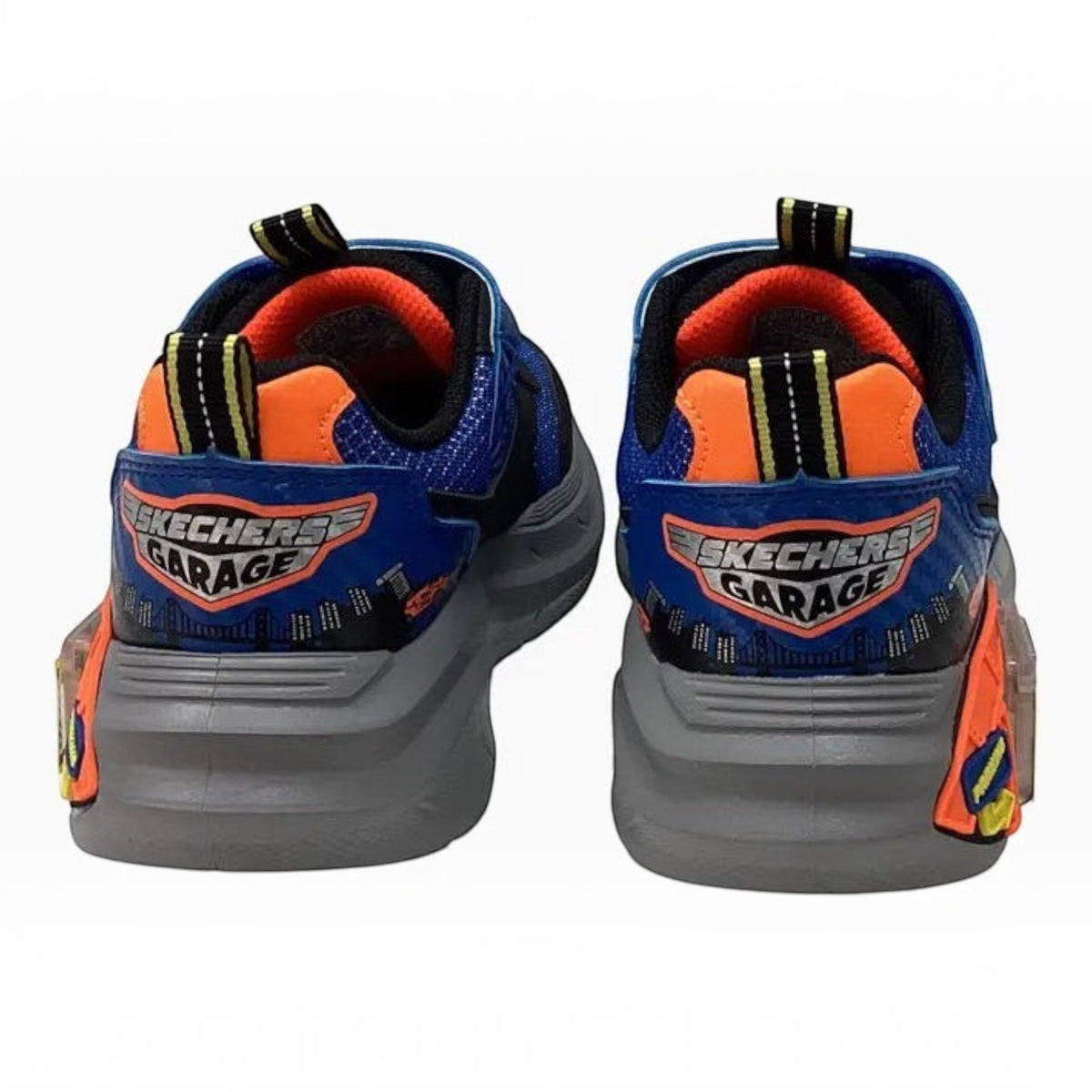 The Shoe Shop Skechers Garage sneakers in blue and orange with car-themed graphics and a grey midsole.