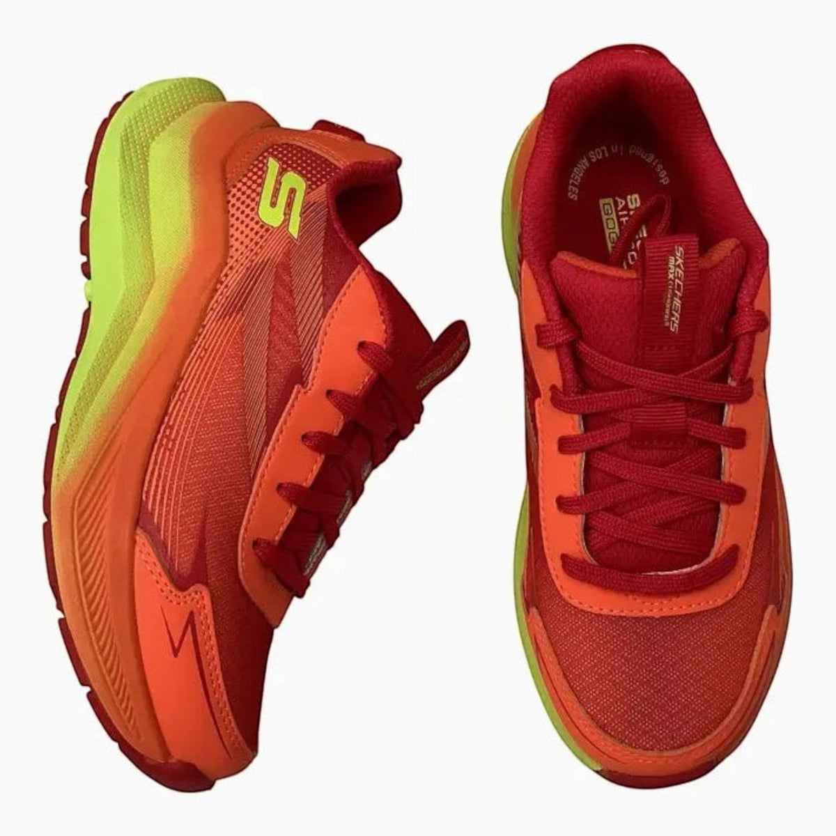 The Shoe Shop Skechers Max Cushioning Ascender sneakers in vibrant red and orange with neon yellow midsoles.