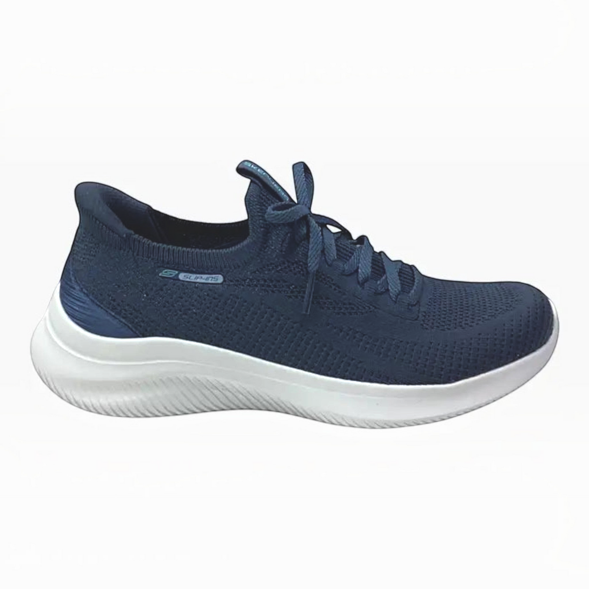 The Shoe Shop Skechers Ultra Flex 4.0 navy blue slip-on sneaker with white cushioned sole and knit upper.