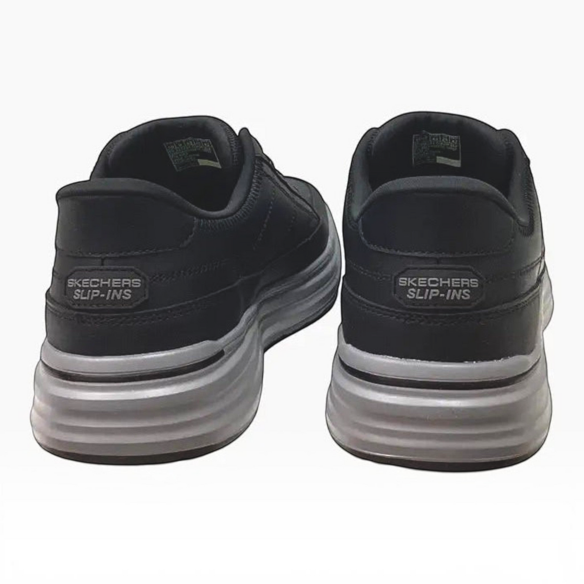 The Shoe Shop Skechers Sterling-Hansel slip-on shoes in black with a grey cushioned heel and slip-in design.