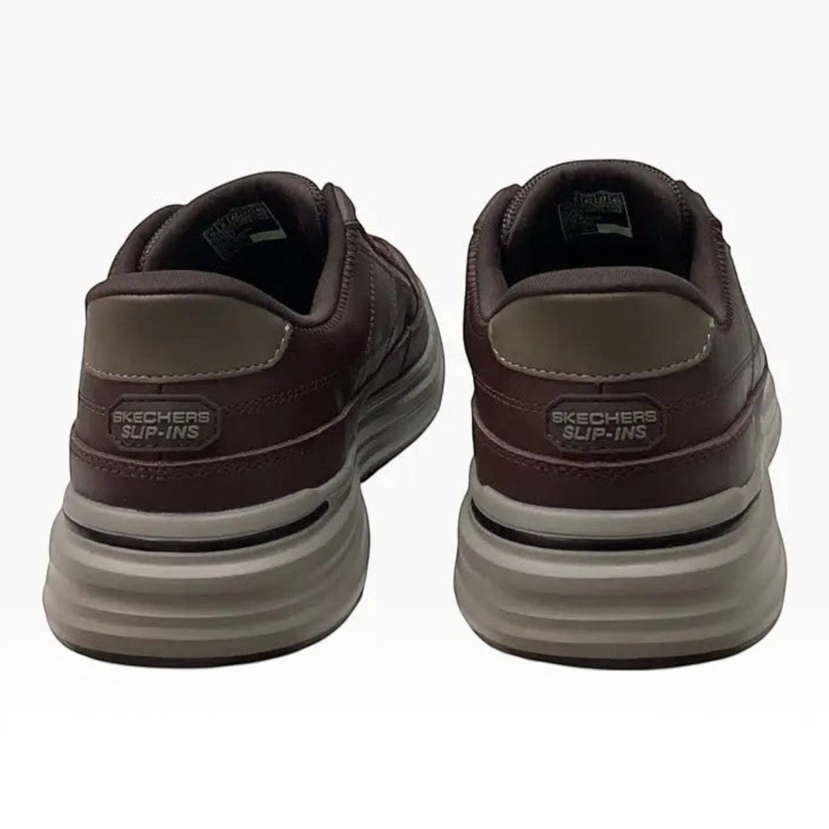 The Shoe Shop Skechers Sterling-Hansel slip-in shoes in brown leather with a cushioned heel and grey traction sole.