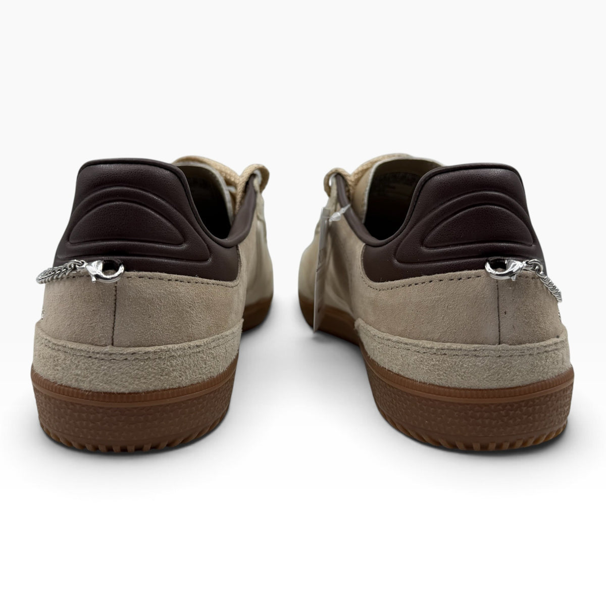 The Shoe Shop Skechers Hotshot City Charm sneakers in beige suede with brown heel detail and silver chain charms