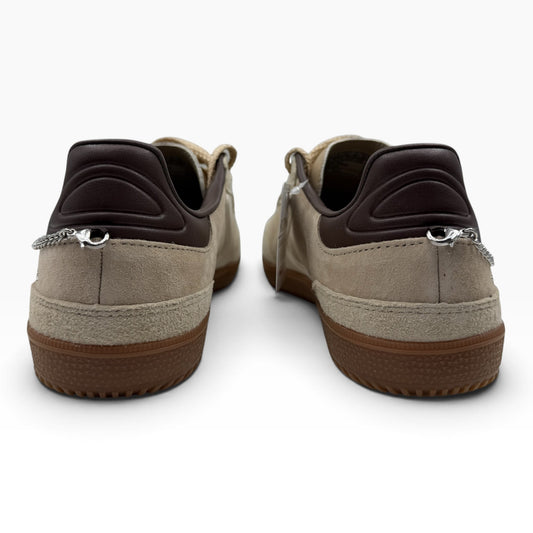 The Shoe Shop Skechers Hotshot City Charm sneakers in beige suede with brown heel detail and silver chain charms