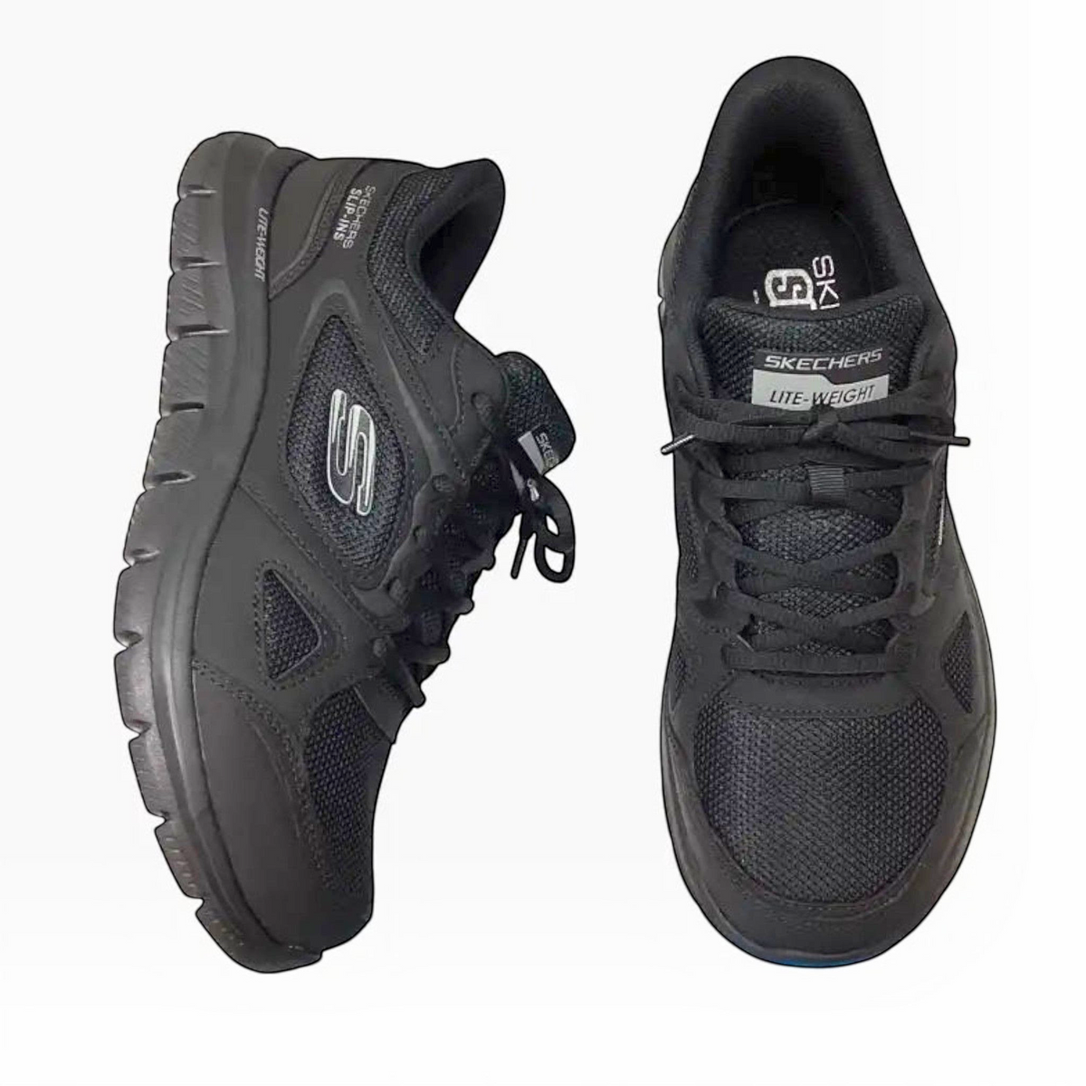 The Shoe Shop Skechers Track Ezral black slip-in sneakers with mesh upper, leather overlays, and cushioned insoles.