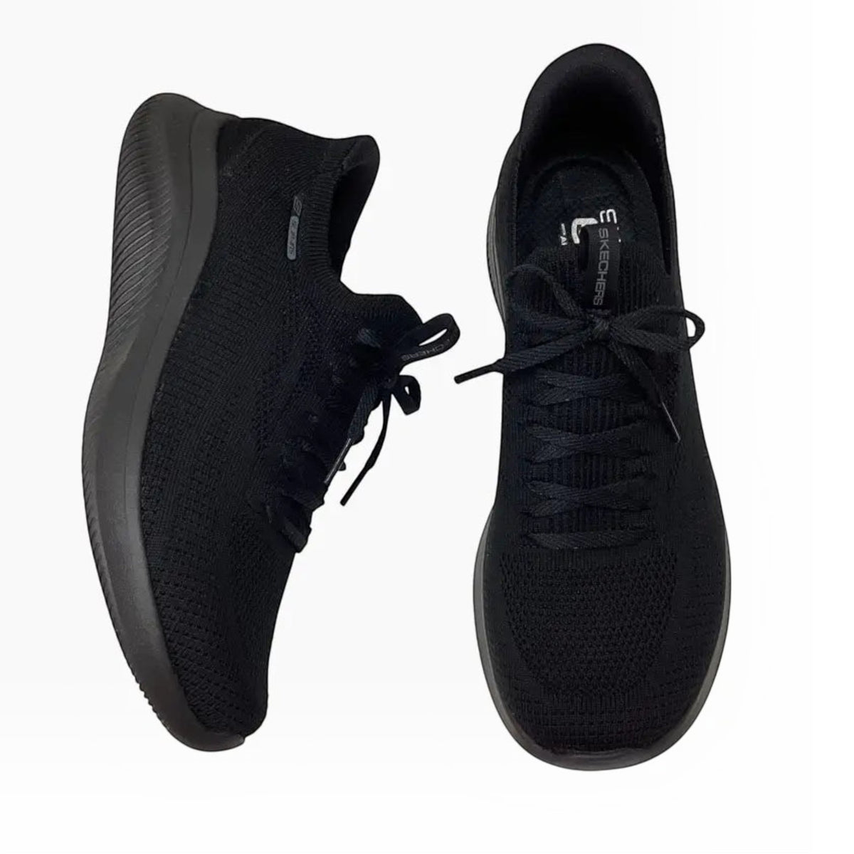 The Shoe Shop Skechers Ultra Flex 4.0 black vegan slip-on sneakers with engineered knit upper and memory foam insole.