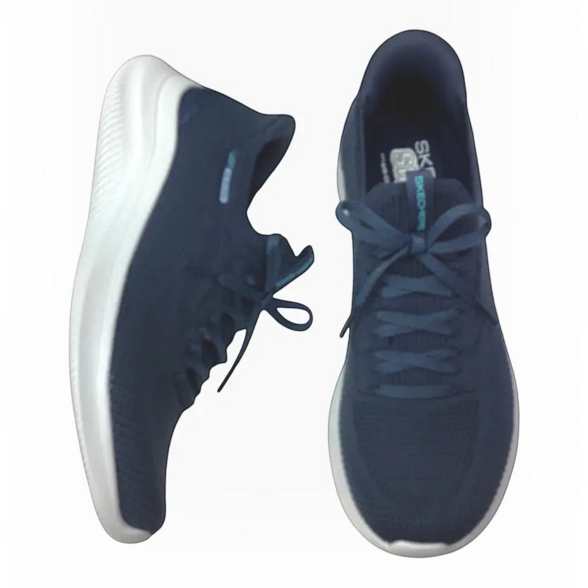 The Shoe Shop Skechers Ultra Flex 4.0 navy blue slip-on sneakers with stretch knit upper and white cushioned sole.