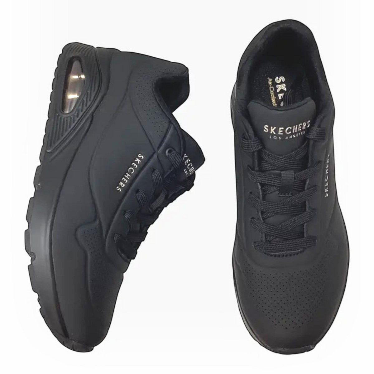 The Shoe Shop Skechers Uno Stand On Air black sneakers with perforated synthetic upper and visible air cushion heel.
