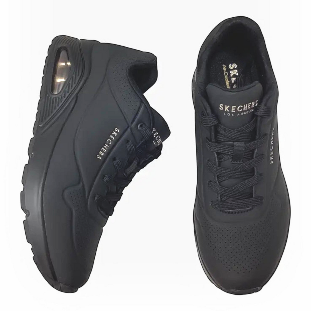 The Shoe Shop Skechers Uno Stand On Air wide black sneakers with perforated synthetic upper and air-cushioned midsole.