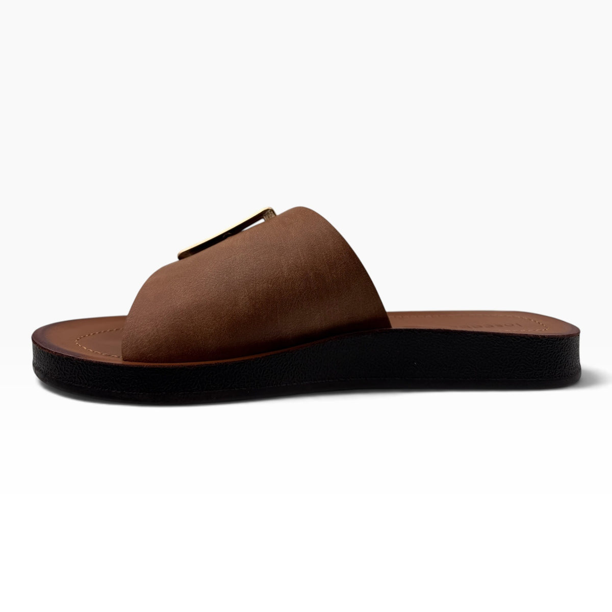 The Shoe Shop Skye Wide brown suede slide sandal with a gold buckle detail and a flat black textured sole.