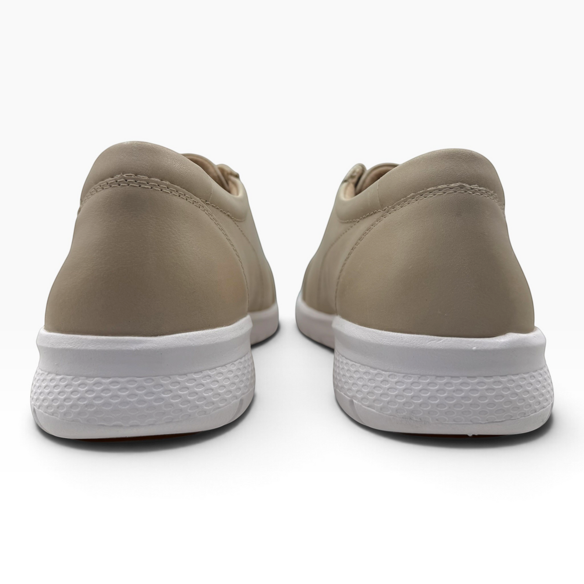 The Shoe Shop Solar XF leather sneakers in beige with a white slip-resistant sole, shown from the back view.