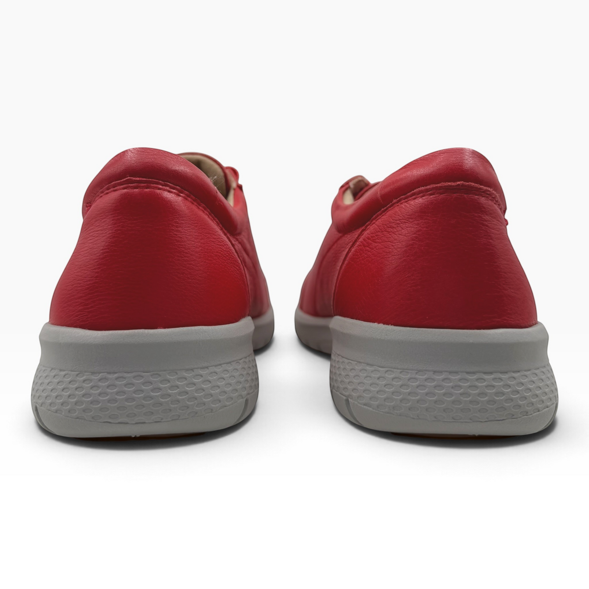 The Shoe Shop Solar XF red leather sneakers showing the back view with a grey textured slip-resistant sole