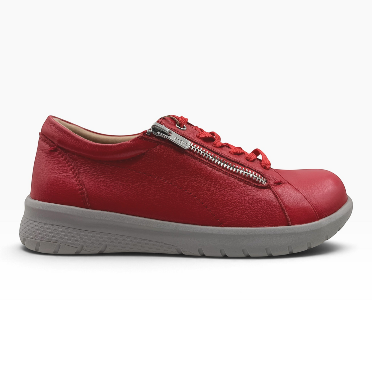 The Shoe Shop Solar XF red leather sneaker with side zip, lace-up closure, and supportive grey slip-resistant sole.