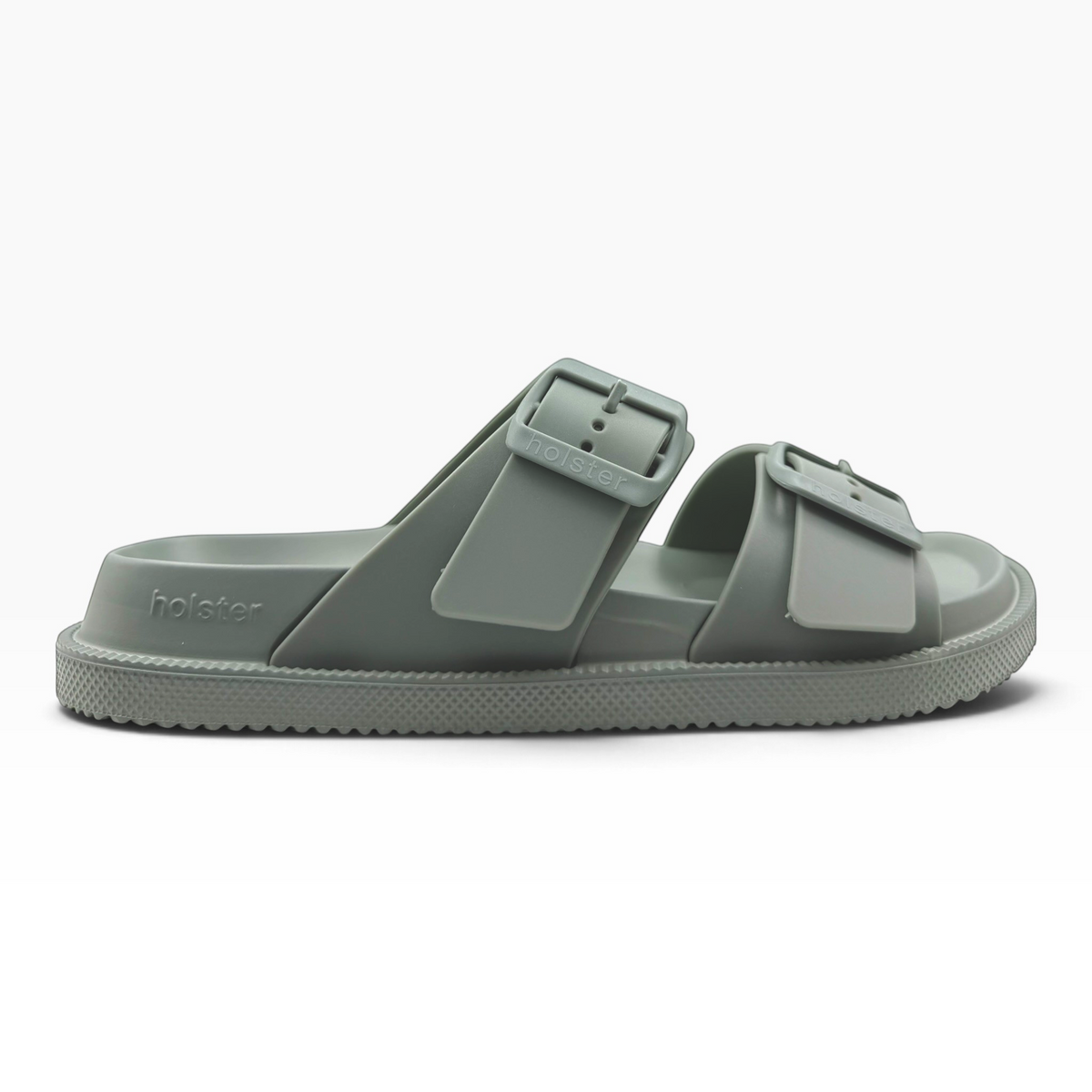 The Shoe Shop Soleseeker slide sandal in sage green with adjustable double straps and a cushioned footbed.