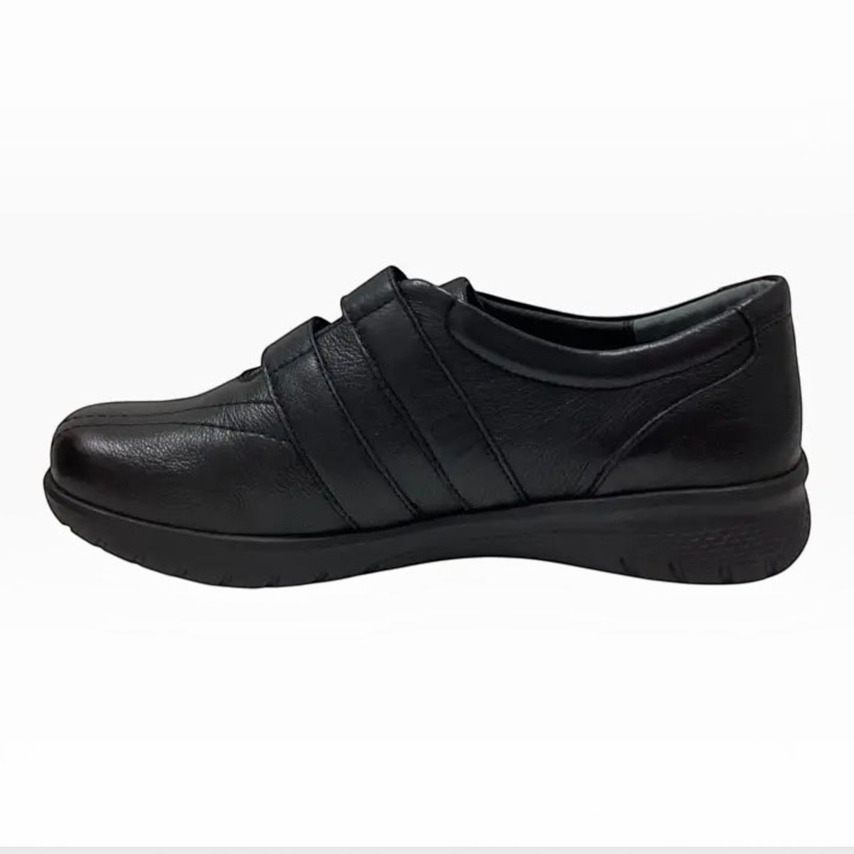 The Shoe Shop Sonnye sneaker in black leather with a comfortable slip-on design and supportive sole.