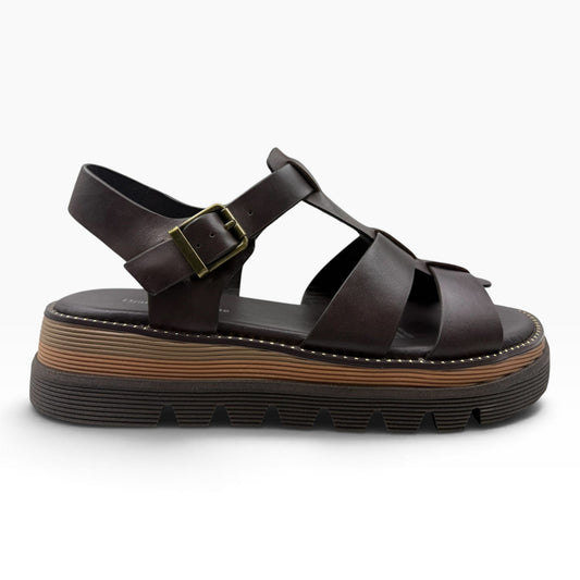 The Shoe Shop Sylvera platform sandal in dark brown leather with wide cross-straps and a chunky ridged rubber sole.