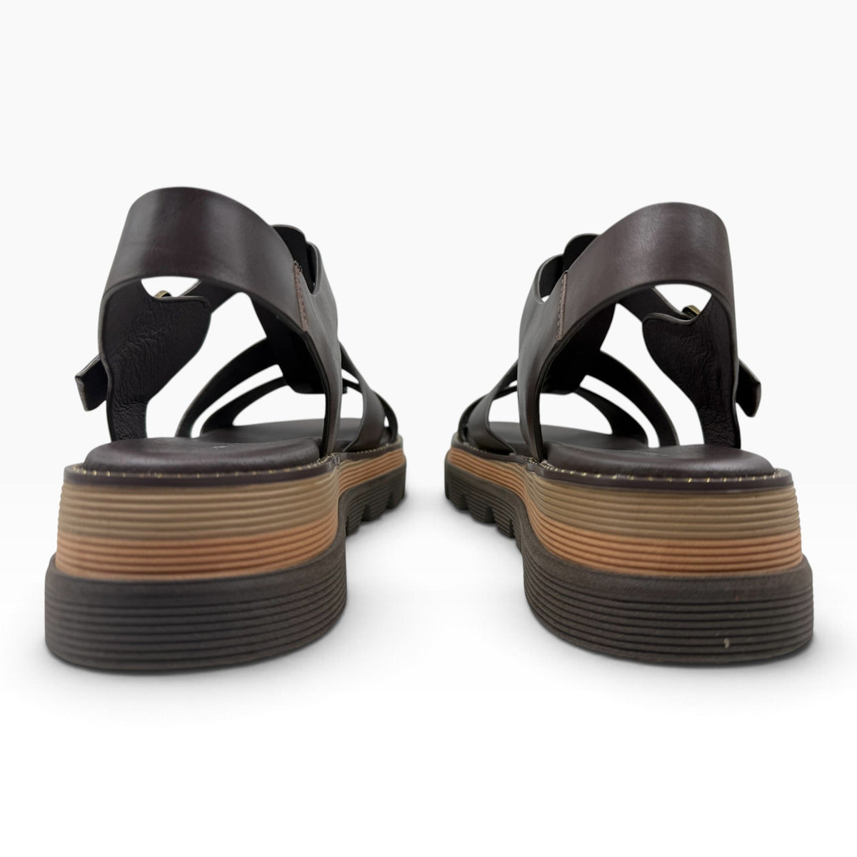 The Shoe Shop Sylvera platform sandals in dark brown leather with a chunky ridged rubber sole, rear view.