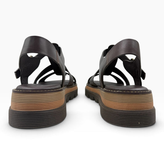 The Shoe Shop Sylvera platform sandals in dark brown leather with a chunky ridged rubber sole, rear view.