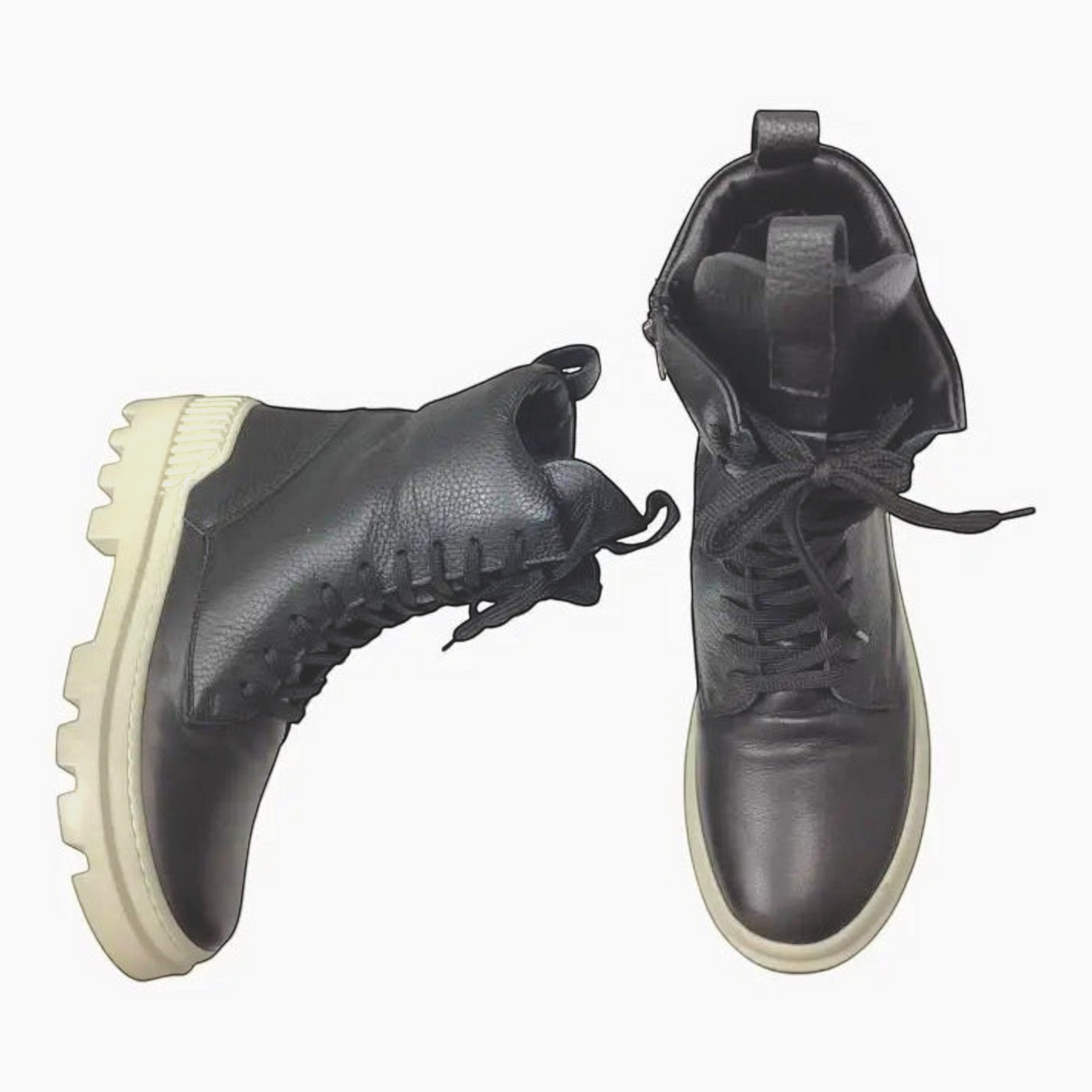 The Shoe Shop Rilassare Taigan black leather lace-up boots with chunky cream rubber soles and inner zip access.