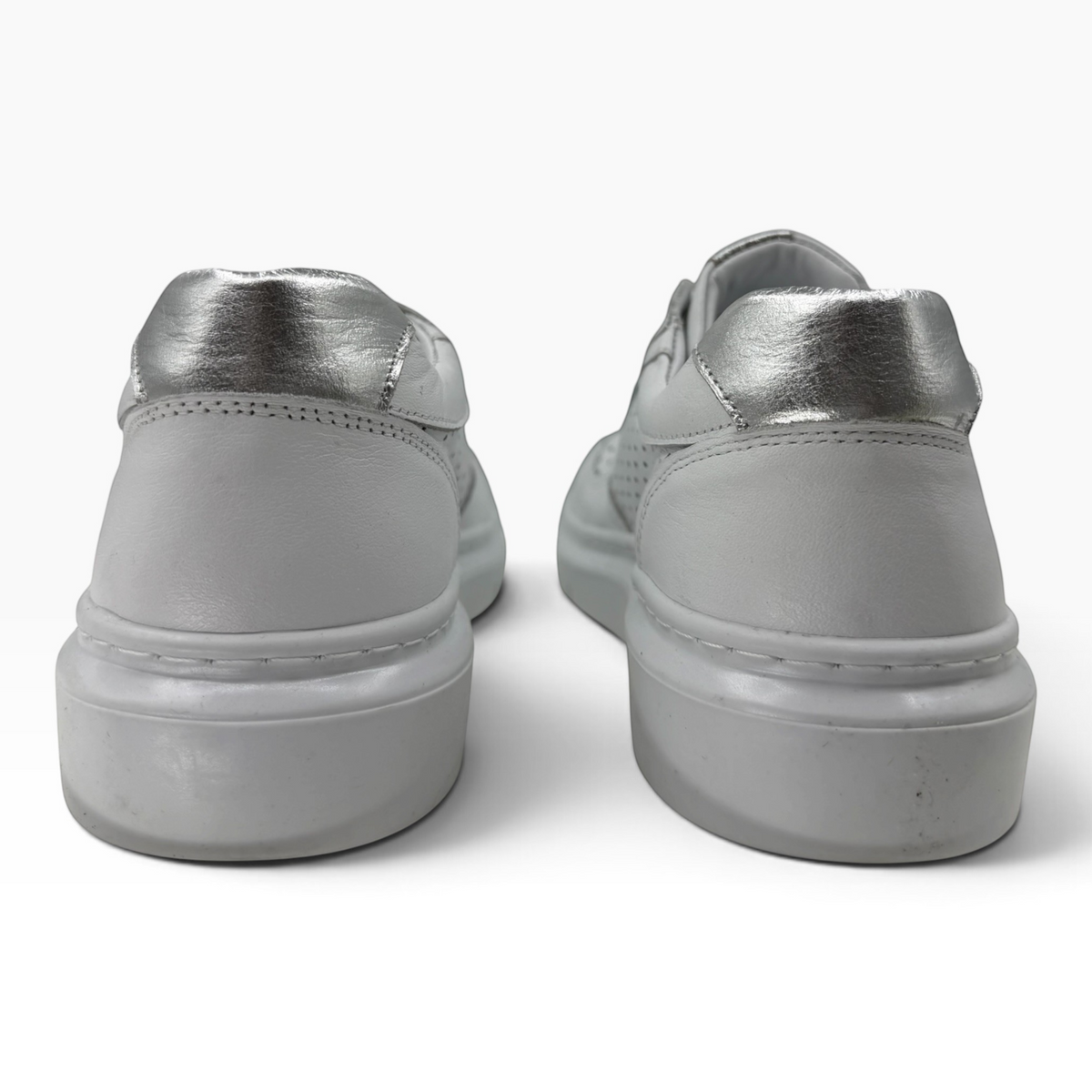 The Shoe Shop Taurus white leather sneakers with metallic silver heel detail, shown from the back.