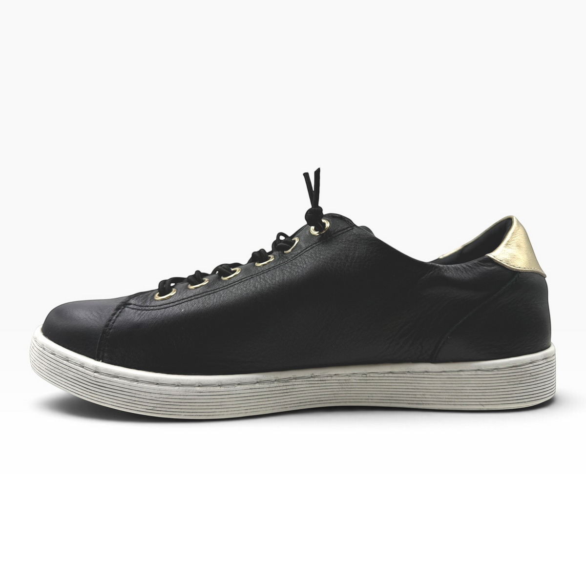 The Shoe Shop Rilassare Temi black soft leather sneaker with gold heel detail and white durable sole