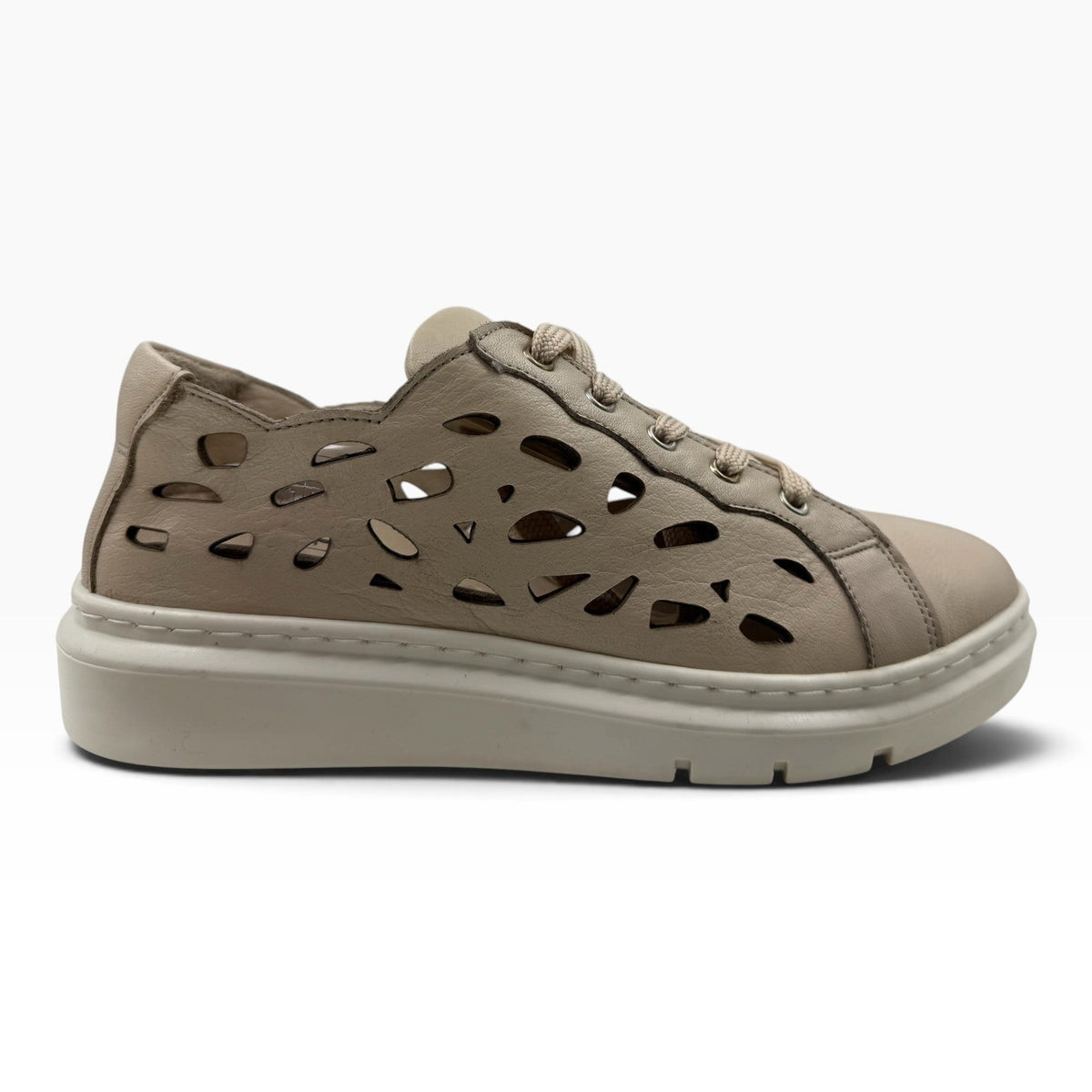 The Shoe Shop Tira sneaker in beige faux leather with laser-cut side panels and a cushioned platform sole.