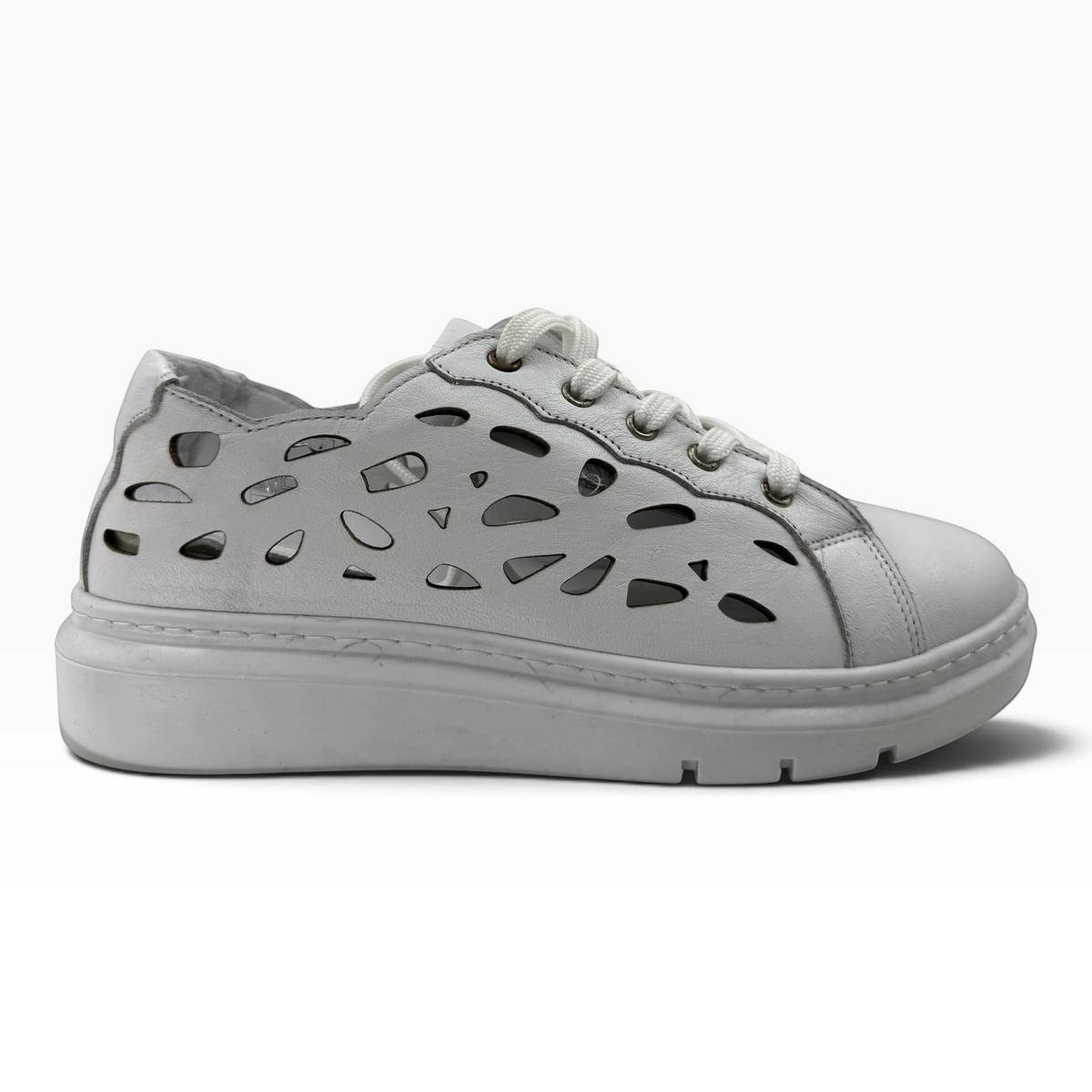 The Shoe Shop Tira white leather sneaker with decorative laser-cut side panels and a thick platform sole
