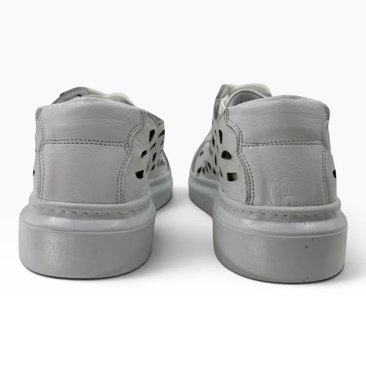 Back view of The Shoe Shop Tira white leather sneakers with laser-cut detailing on a thick rubber sole