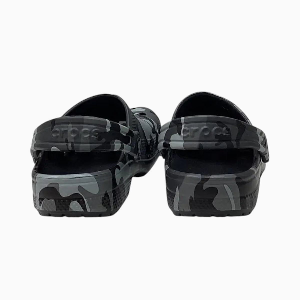 The Shoe Shop toddler Crocs Classic Clogs in a grey and black camo print with pivoting heel straps, rear view.
