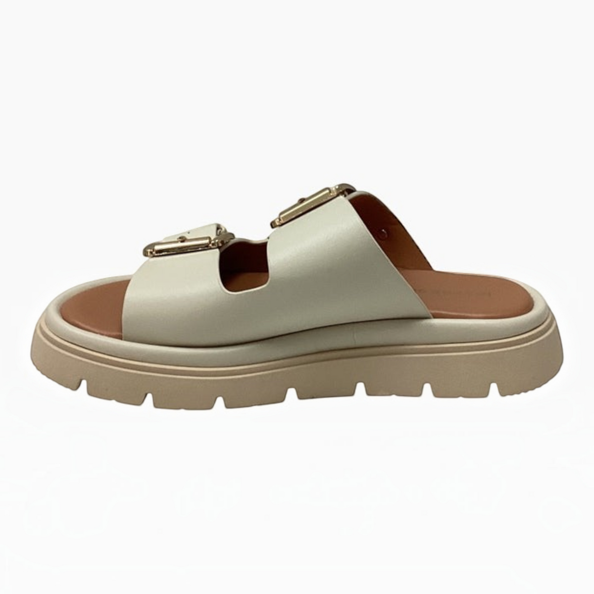 The Shoe Shop Toledo Slide in cream with twin adjustable gold buckle straps and a chunky lug sole platform.