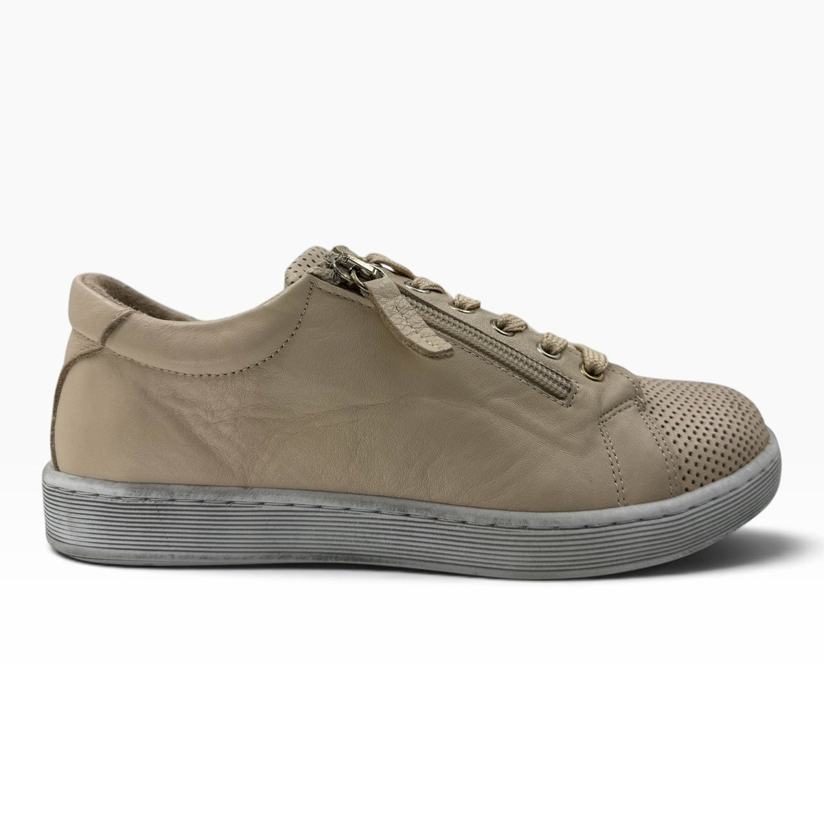 The Shoe Shop Tommie Perf sneaker in beige leather with perforated detailing, side zip, and durable rubber sole.